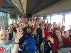 I'm in the third row on the right aisle with the sun glasses and gray hair.